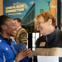 Lynn Blue smiling at a student at the Lynn M. Blue Connection Naming Ceremony